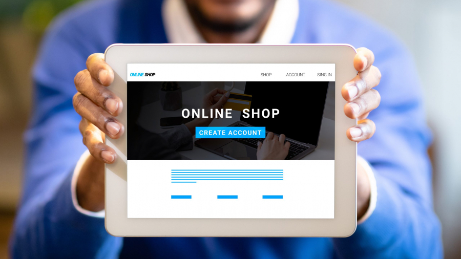 Young black businessman showing tablet with online shop website on screen, creative collage. Panorama